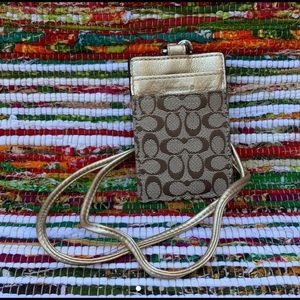 Coach, Classic Leather print wallet/lanyard.